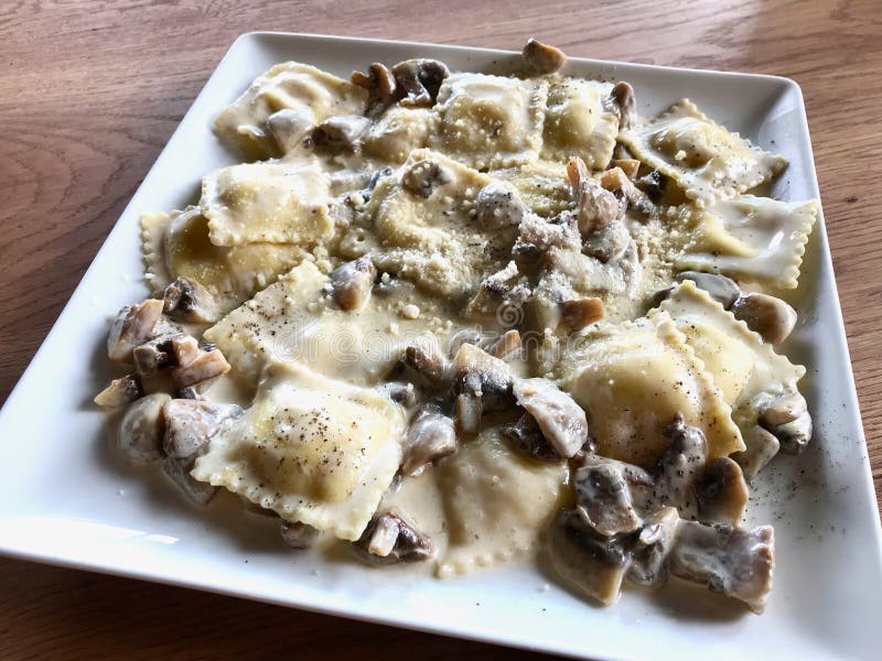 Mushroom Ravioli Pasta with Cream Sauce in Rectangular Plate Stock