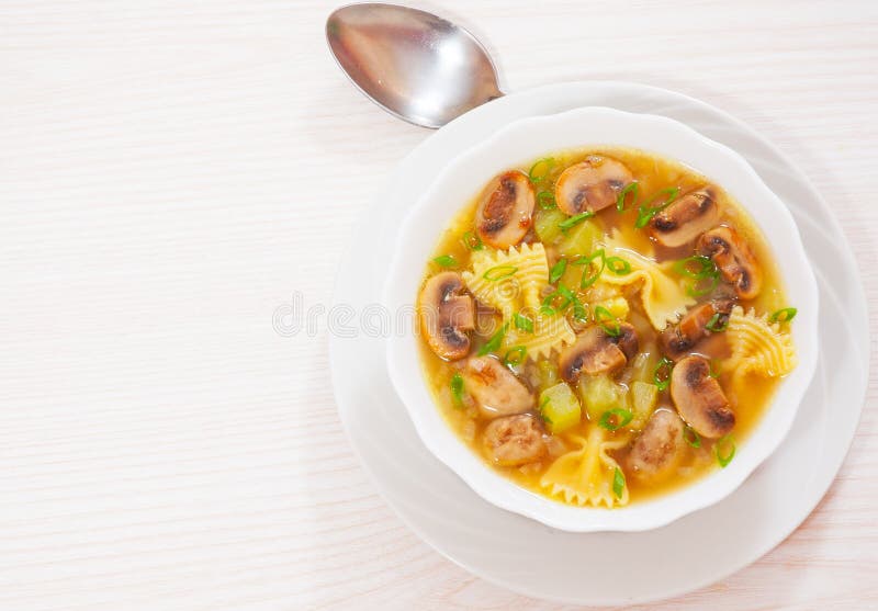 Mushroom soup with pasta and vegetables