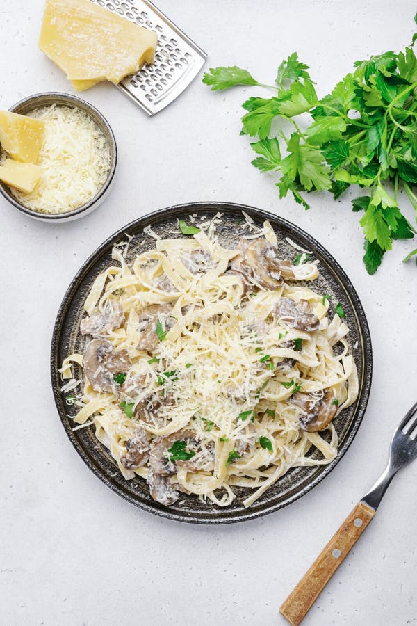 Mushroom Tagliatelle Pasta with Parmesan Cheese and Cream Sauce on ...