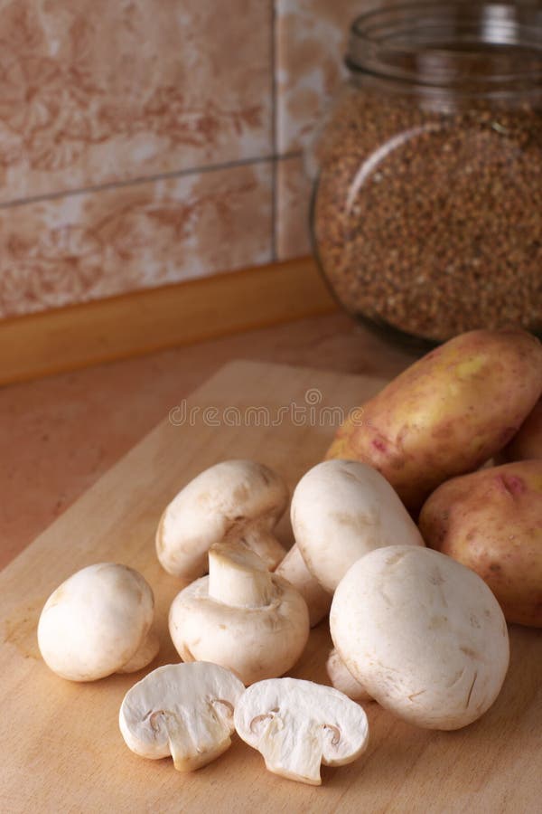 Mushrooms and potatoes stock image. Image of still, board 7502721