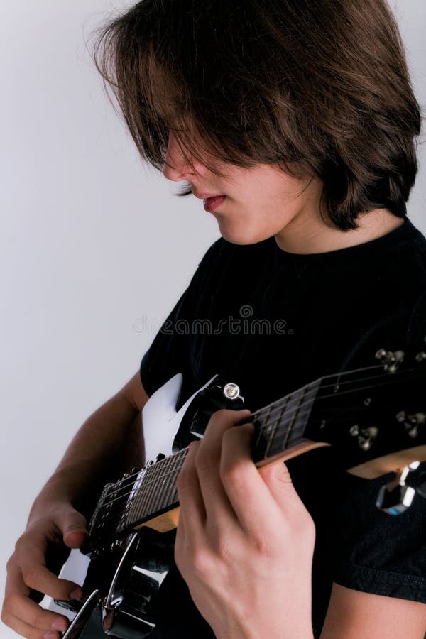 Rocker with electric guitar Stock Photo by ©DmitryPoch 150945576