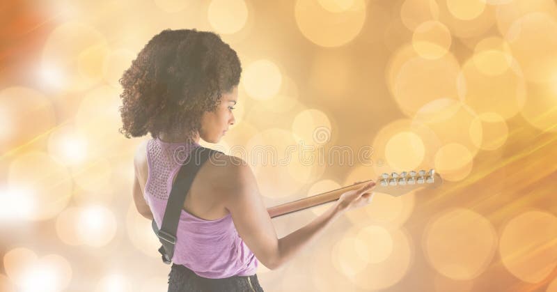 Music artist playing guitar over blur background