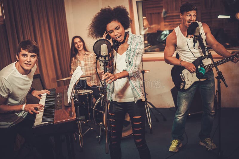 Music Band Performing in a Studio Stock Photo Image of playing, drums