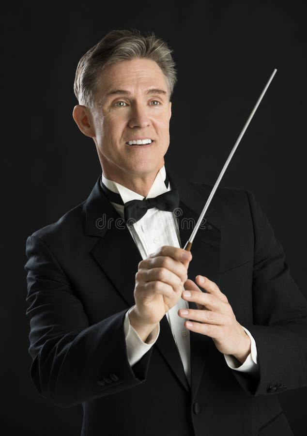 Music Conductor Smiling While Directing With His Baton