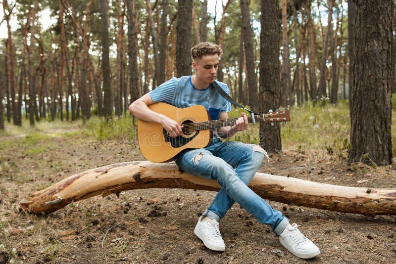 Music lifestyle man playing guitar nature concept. royalty free stock photos Music lifestyle man playing guitar nature concept. royalty free stock photos