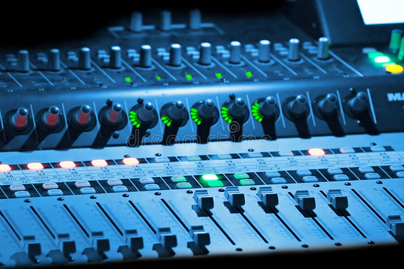 Professional music mixer in blue light