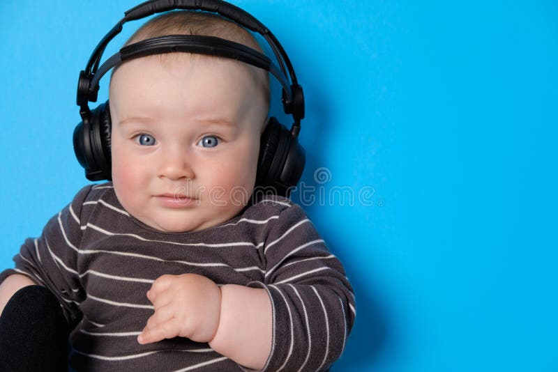 Music or Podcast Background with Baby Boy with Headphones and ...