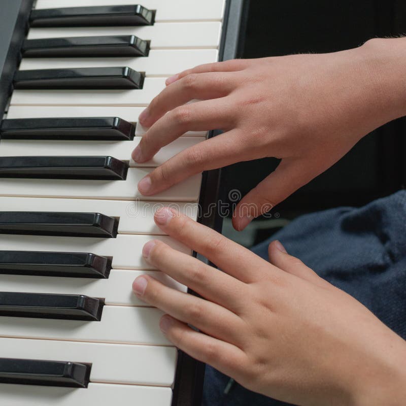 Music Practice on Piano Keyboard. Two Hands Playing Exercises Stock