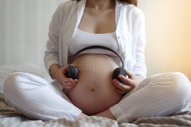 Headphones on belly stock image. Image of baby, device - 8381095