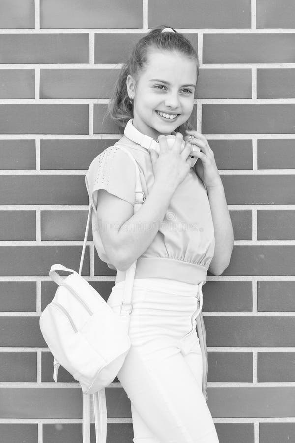 Music is the soundtrack of your life. Cute little girl wearing headphones for music listening. Small child enjoying stock photos Music is the soundtrack of your life. Cute little girl wearing headphones for music listening. Small child enjoying stock photos