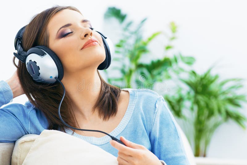 Music woman. Girl listening music with headphones.