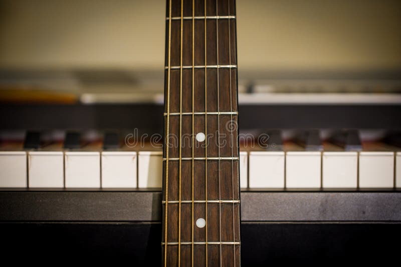 Musical Instruments Piano Keys and Acoustic Guitar Stock Image Image