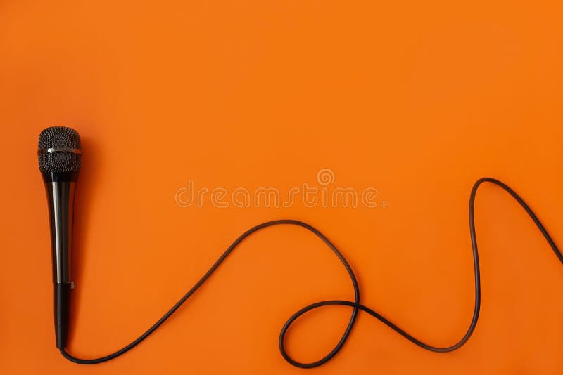 Musical mycraphone on an orange background stock image