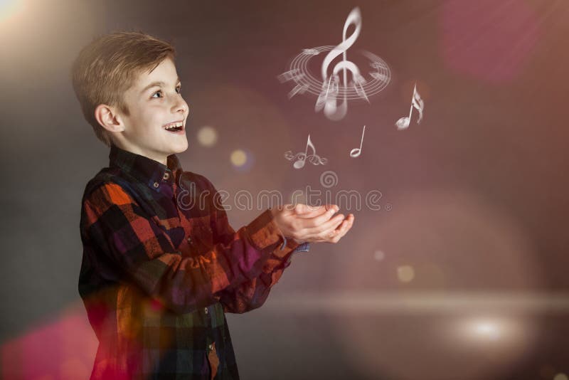 Musical Notes Over the Hands of a Happy Boy