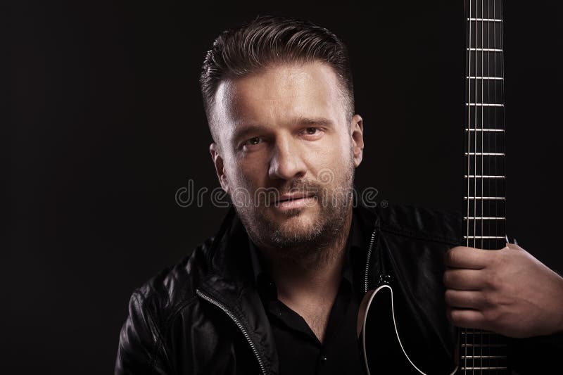 Musician male sits with guitar stock photography Musician male sits with guitar stock photography