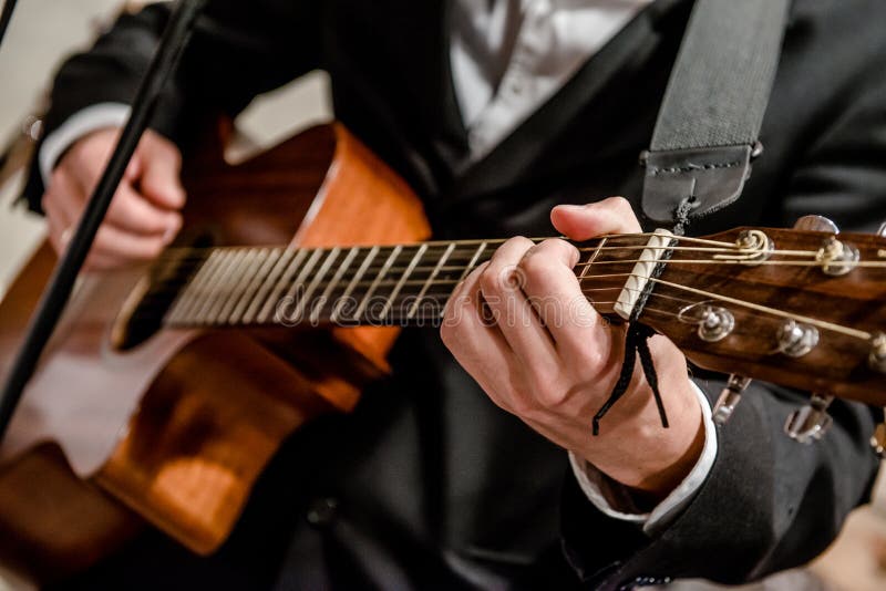 Musician playing a guitar