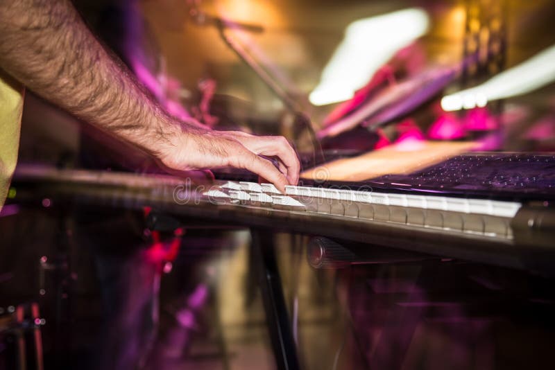 Musician Plays Keyboards in a Rock Band Stock Image - Image of