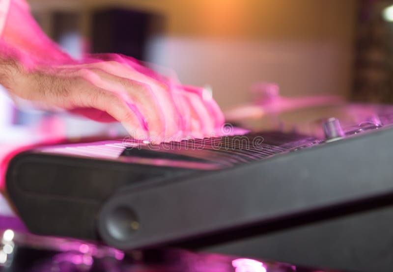 Musician Plays Keyboards in a Rock Band Stock Image - Image of sound