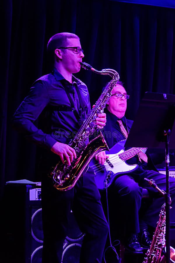 Musician Playing Saxophone in Harbor of Tel Aviav Editorial Stock Photo