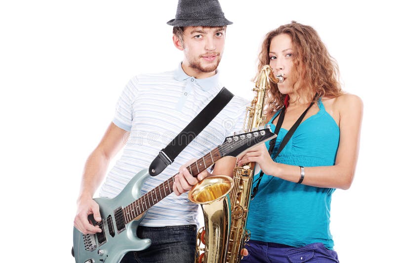 Shot of a musical band playing their instruments with great emotions. Shot of a musical band playing their instruments with great emotions.