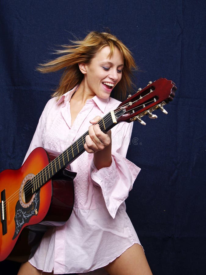 Beautiful young adult girl with guitar. Beautiful young adult girl with guitar