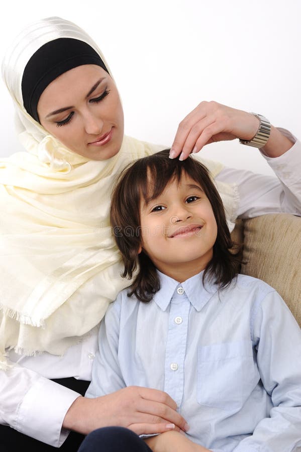 Muslim arabic covered mother and son relaxing