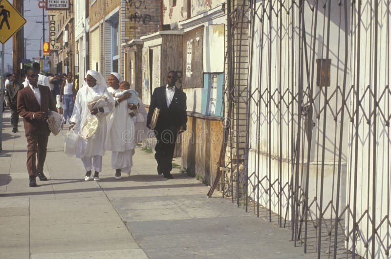 Muslim families standing on sidewalk, South Central Los Angeles, California