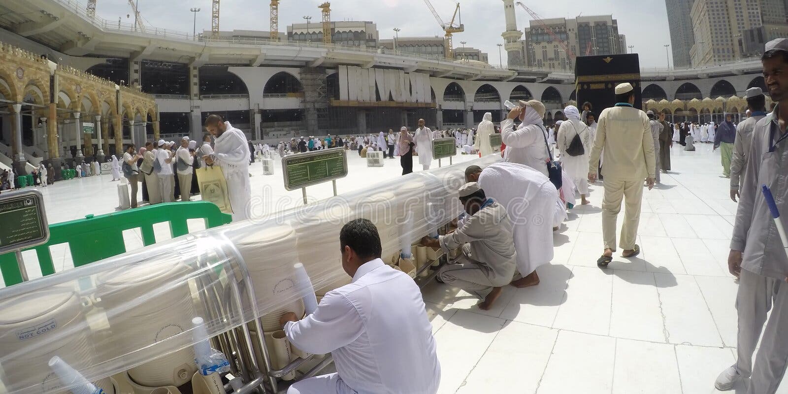 muslim pilgrims drinking zamzam water perform umrah hajj haram mosque 96736032