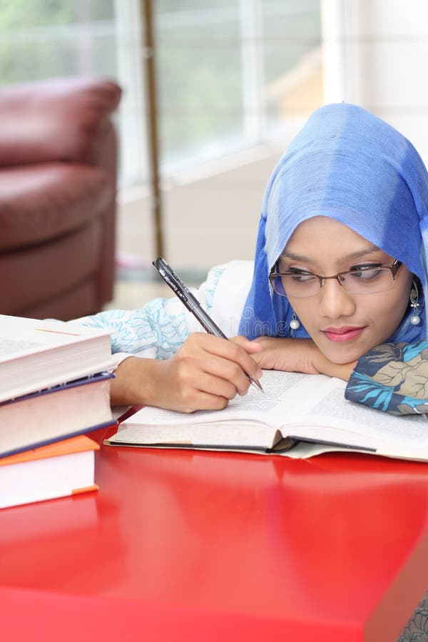 Muslim woman with a book