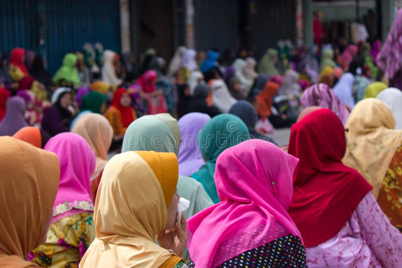 Muslim women during Friday Prayers in Kota Bharu, Malaysia. Muslim woman in colorful hijabs during Friday prayers in the Islamic City of Kota Bharu, Malaysia royalty free stock image Muslim women during Friday Prayers in Kota Bharu, Malaysia. Muslim woman in colorful hijabs during Friday prayers in the Islamic City of Kota Bharu, Malaysia royalty free stock image