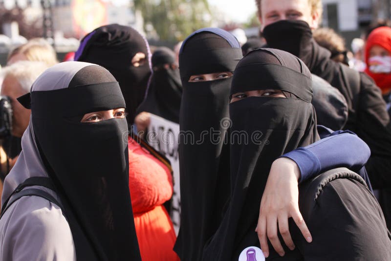 Muslim women protest at demonstration against Danish legislation that ban the use of traditional clothes like burqa and niqab. Copenhagen, Denmark - August 1 royalty free stock photography Muslim women protest at demonstration against Danish legislation that ban the use of traditional clothes like burqa and niqab. Copenhagen, Denmark - August 1 royalty free stock photography