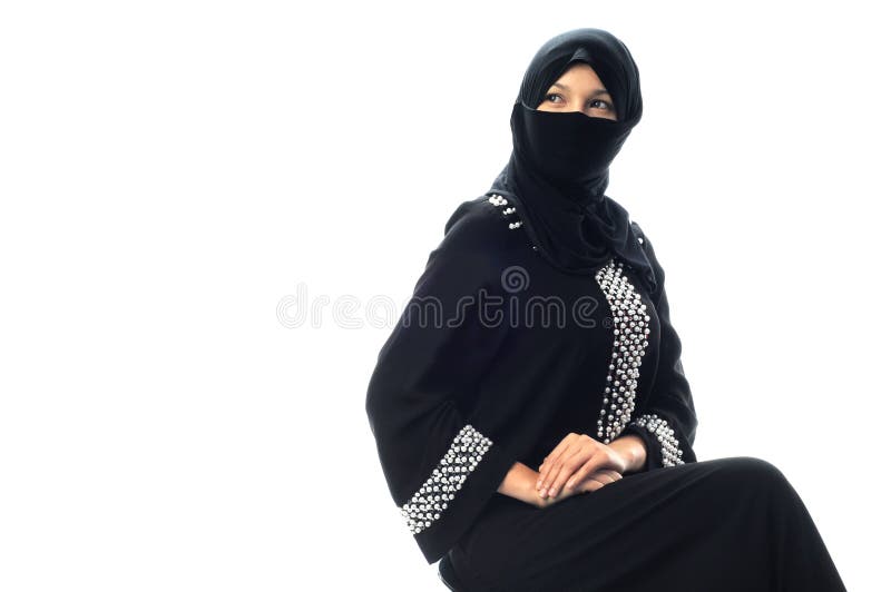 A muslim young women sit and looking to side