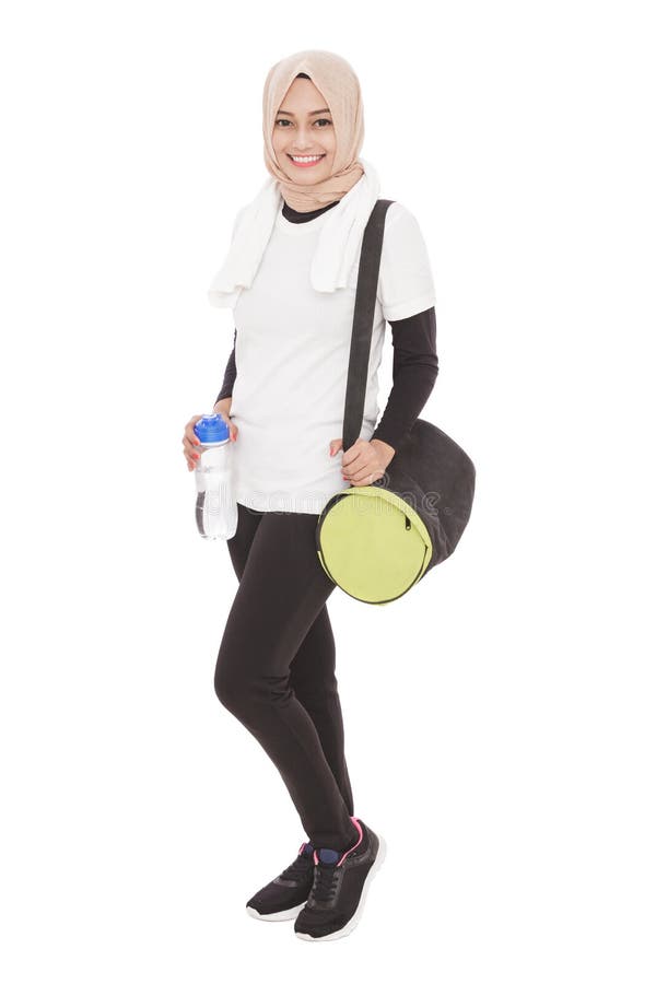 Muslimah sporty woman standing while smiling stock photography Muslimah sporty woman standing while smiling stock photography