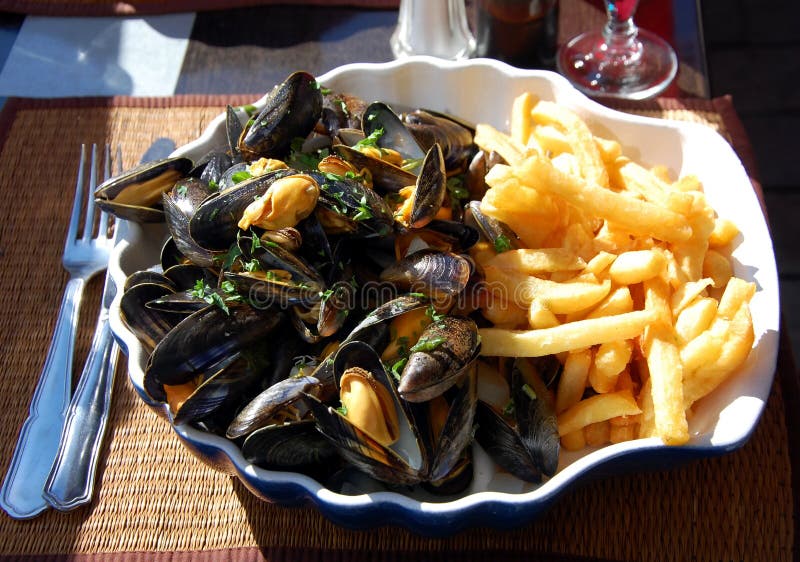 Mussels with French fries stock image. Image of mussels 67731795