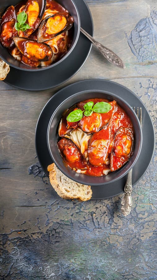 Mussels in tomato sauce and spaghetti. Mussels pasta. Top view Mediterranean Kitchen