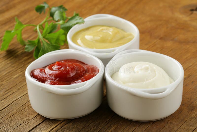 Mustard, ketchup and mayonnaise - three kinds sauces royalty free stock photography Mustard, ketchup and mayonnaise - three kinds sauces royalty free stock photography