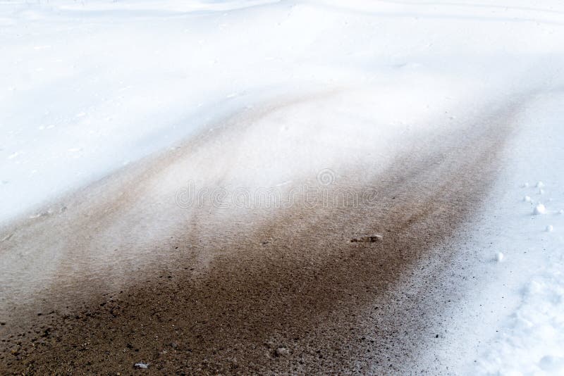Pattern of brown dust and dirt on pure white snow. Pattern of brown dust and dirt on pure white snow