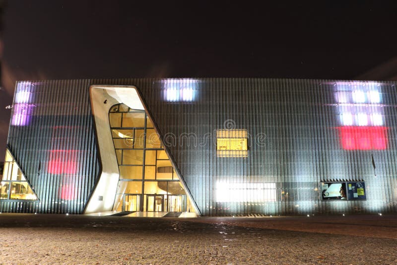 Building of the Museum of History of Polish Jews at night. It is a new museum on the site of the Warsaw ghetto, opened on April 19, 2013. The museum will feature multimedia exhibits on vibrant Jewish community that flourished in Poland for a thousand years. The building, a modern structure in glass and limestone, was designed by Finnish architects Rainer Mahlamäki and Ilmari Lahdelma. Building of the Museum of History of Polish Jews at night. It is a new museum on the site of the Warsaw ghetto, opened on April 19, 2013. The museum will feature multimedia exhibits on vibrant Jewish community that flourished in Poland for a thousand years. The building, a modern structure in glass and limestone, was designed by Finnish architects Rainer Mahlamäki and Ilmari Lahdelma.