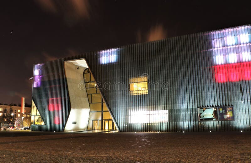 Building of the Museum of History of Polish Jews at night. It is a new museum on the site of the Warsaw ghetto, opened on April 19, 2013. The museum will feature multimedia exhibits on vibrant Jewish community that flourished in Poland for a thousand years. The building, a modern structure in glass and limestone, was designed by Finnish architects Rainer Mahlamäki and Ilmari Lahdelma. Building of the Museum of History of Polish Jews at night. It is a new museum on the site of the Warsaw ghetto, opened on April 19, 2013. The museum will feature multimedia exhibits on vibrant Jewish community that flourished in Poland for a thousand years. The building, a modern structure in glass and limestone, was designed by Finnish architects Rainer Mahlamäki and Ilmari Lahdelma.
