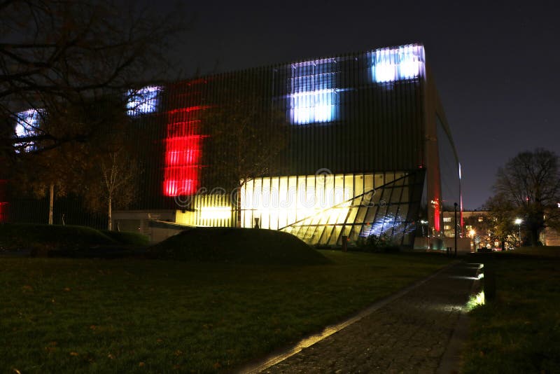 Building of the Museum of History of Polish Jews at night. It is a new museum on the site of the Warsaw ghetto, opened on April 19, 2013. The museum will feature multimedia exhibits on vibrant Jewish community that flourished in Poland for a thousand years. The building, a modern structure in glass and limestone, was designed by Finnish architects Rainer Mahlamäki and Ilmari Lahdelma. Building of the Museum of History of Polish Jews at night. It is a new museum on the site of the Warsaw ghetto, opened on April 19, 2013. The museum will feature multimedia exhibits on vibrant Jewish community that flourished in Poland for a thousand years. The building, a modern structure in glass and limestone, was designed by Finnish architects Rainer Mahlamäki and Ilmari Lahdelma.