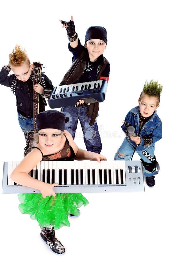 Group of children singing in heavy metal style. Shot in a studio. Isolated over white background. Group of children singing in heavy metal style. Shot in a studio. Isolated over white background.