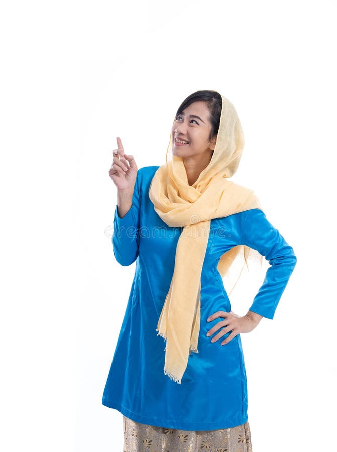 Muslim woman wearing blue look up and thinking to copy space. Muslim woman wearing blue look up and thinking to copy space