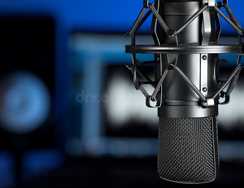 Microphone in the music recording studio , focus on the microphone, for music production,audio,entertainment themes. Microphone in the music recording studio , focus on the microphone, for music production,audio,entertainment themes