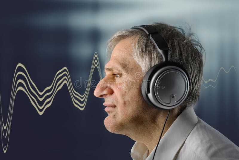 Profile of mature man listening music. Profile of mature man listening music