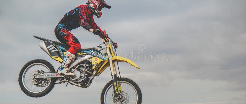 MX moto cross racing - Girl Bike Rider riding on dirt track - extreme jump. Extreme Motocross . stock images MX moto cross racing - Girl Bike Rider riding on dirt track - extreme jump. Extreme Motocross . stock images