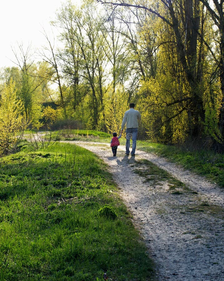 The Eldest Daughter Walks Down The Flower Path My Dad. Father and Daughter Walk Down the Path. Stock Image - Image of