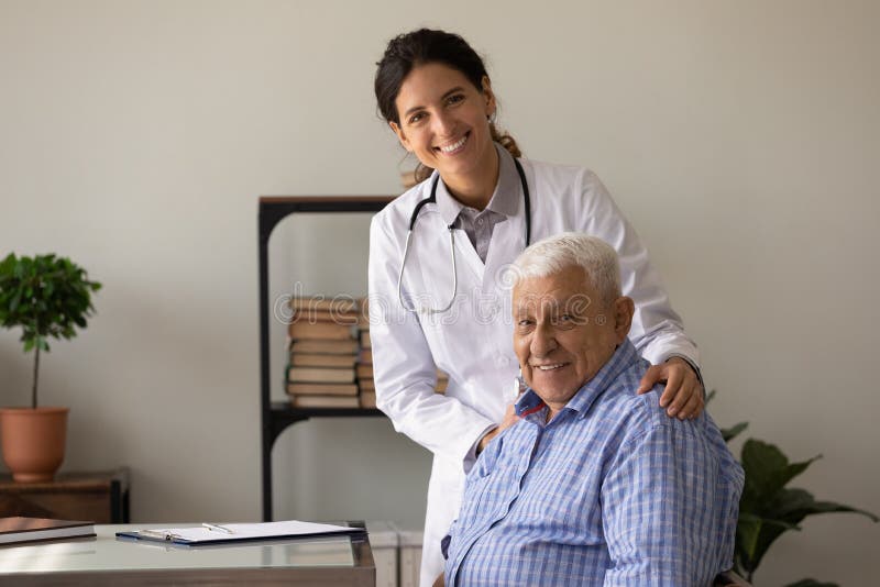 Portrait of smiling doc and retired patient in doctor office