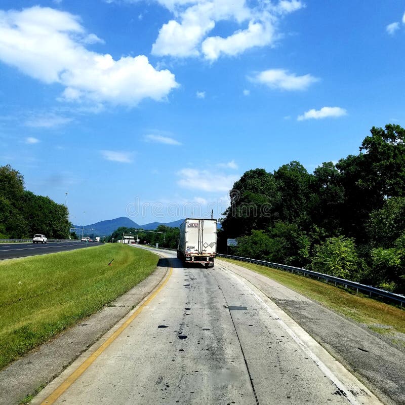 The View I See Driving Tractor Trailer Over the Road Stock Photo