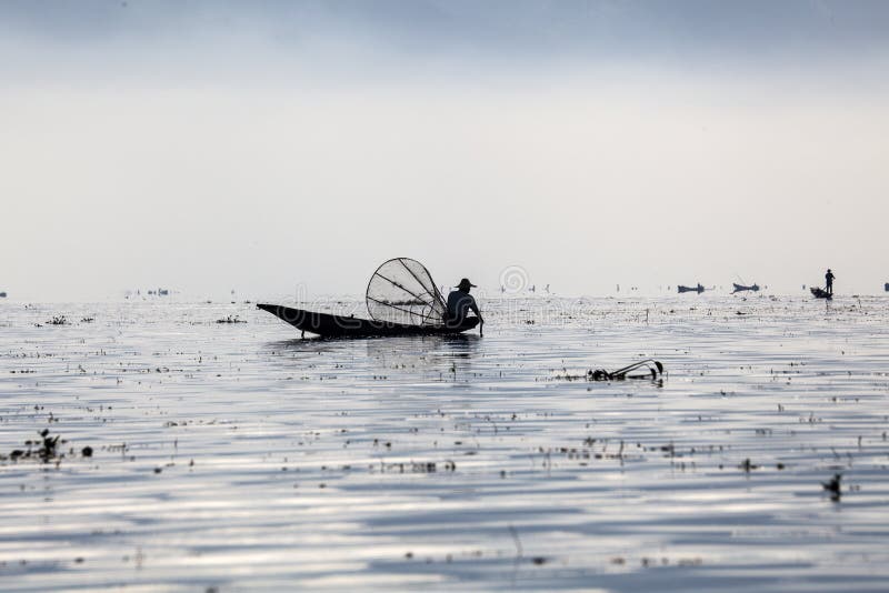 Myanmar, man fishing on Inle lake