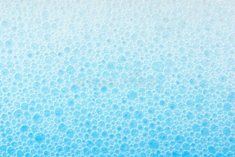 Blue soap bubble foam background. Blue soap bubble foam background